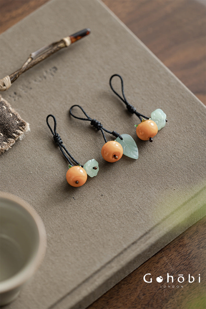 Gohobi Persimmon Teapot Lid Pendant – Handwoven Retractable Teapot Lid Rope