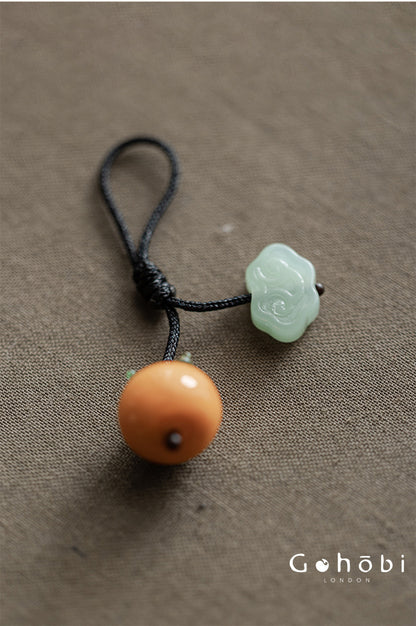 Gohobi Persimmon Teapot Lid Pendant – Handwoven Retractable Teapot Lid Rope