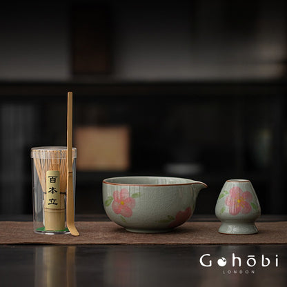 Matcha set with floral design on a dark background, featuring the brand 'Gohobi London'.